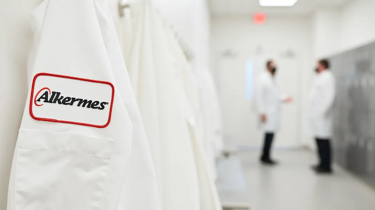 An Alkermes lab coat hangs in one of the company's offices.