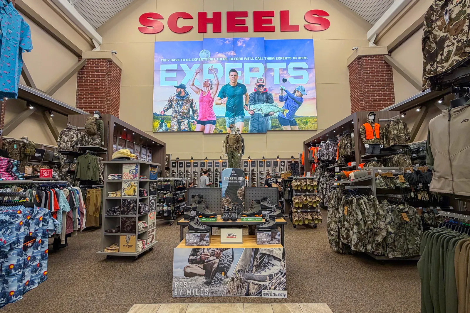 An in-store display of hunting apparel at a Scheels store.