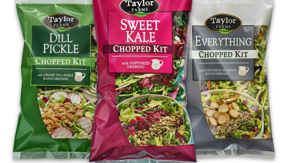 Bags of Taylor Farms chopped salad kits.