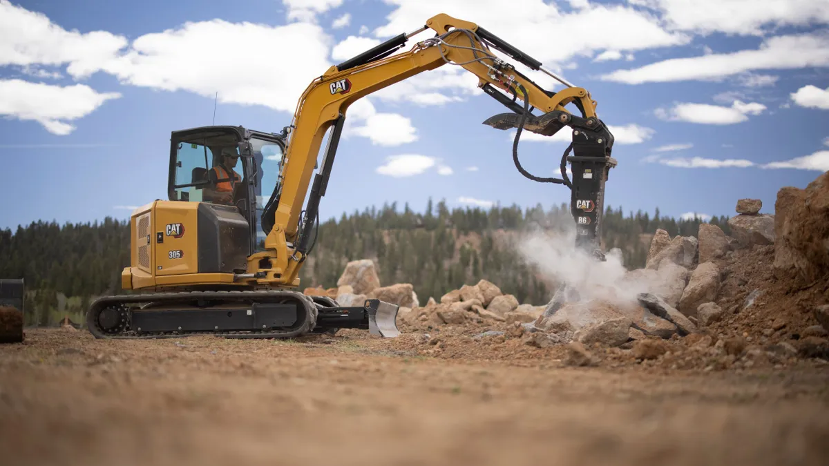 A Caterpiller excavator machine in use.