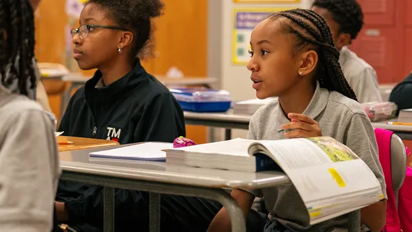 Students sit rows in a New York City classroom