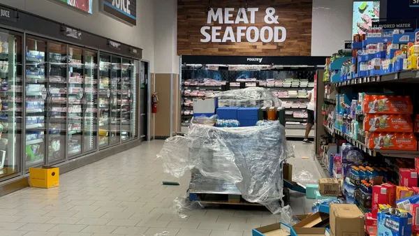 Boxes strewn around a grocery store's sales floor.