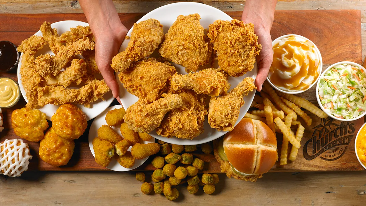 An overhead view of fried chicken and sides.