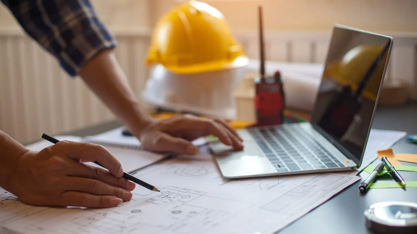 Concept Architect and desk of Architectural project in construction site or office building with mining light