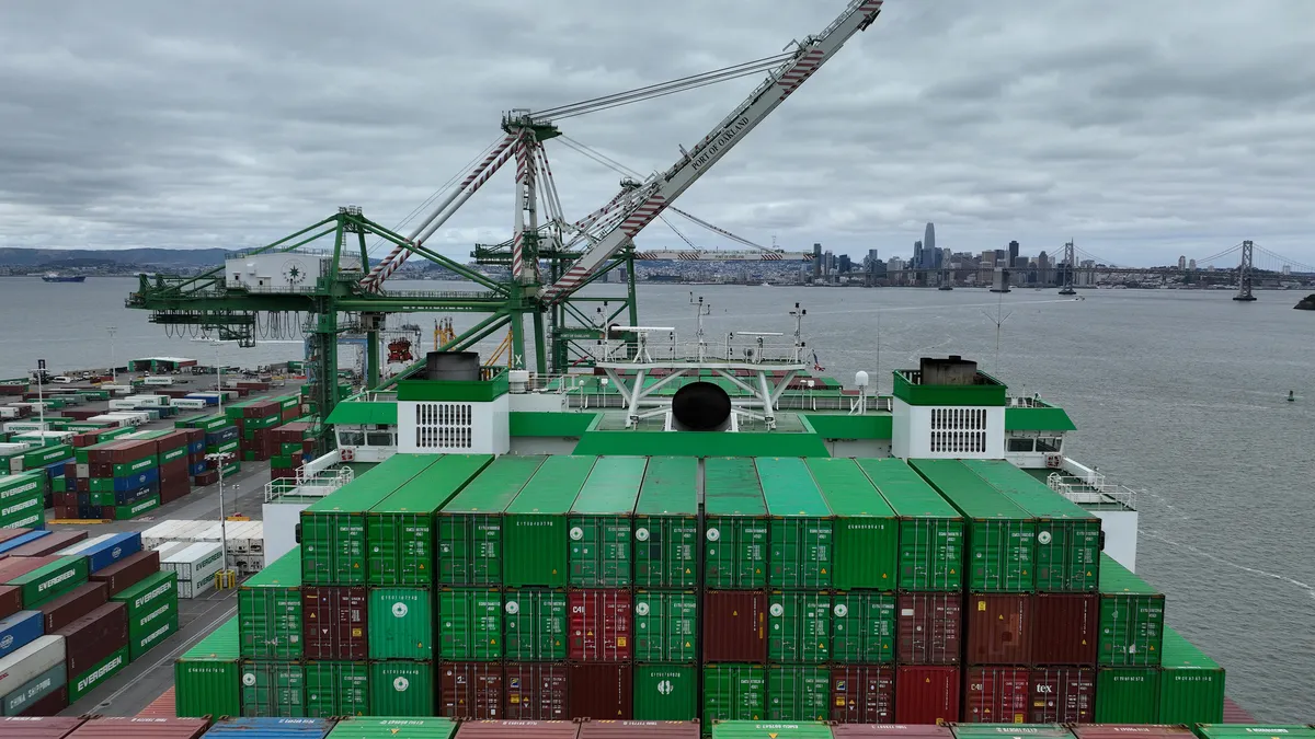 A container ship sits docked at the Port of Oakland on June 07, 2023.