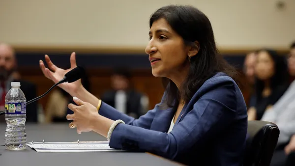 Federal Trade Commission Chair Lina Khan testifies at a committee hearing.