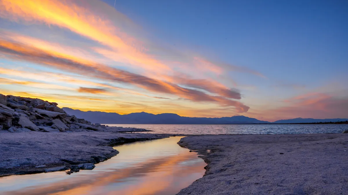 An image of the sun setting over the Salton Sea.