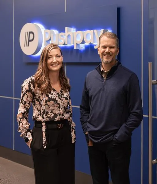 Former Pushpay CEO Molly Matthews stands next to new CEO Kenny Wyatt