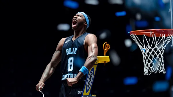 A basketball player cuts down the net in a Powerade ad