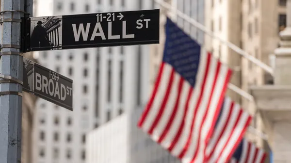 American flags on a building on Wall Street