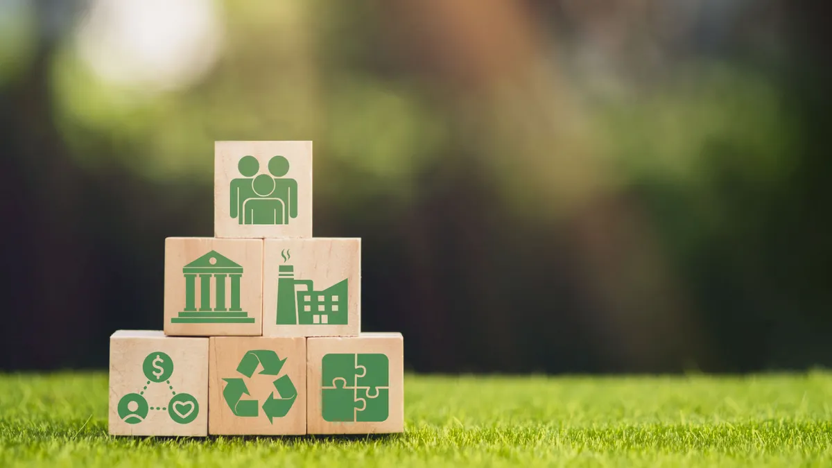 Wooden cube block with ESG icon with copy space, social and corporate governance concept. ESG modernization development by using the technology of renewable resources to reduce pollution and carbon em