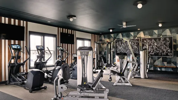 A fitness room with workout equipment.