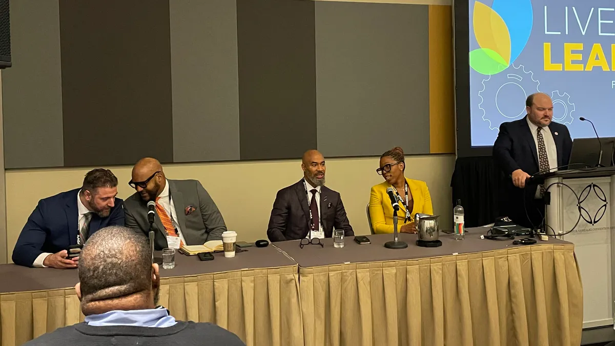 A diverse panel of four superintendents speaks to attendees during a session at AASA's 2023 National Conference on Education in San Antonio, Texas.