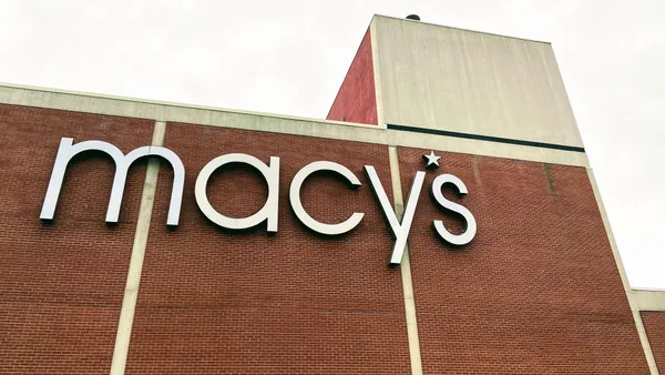 An exterior sign on a Macy's store.