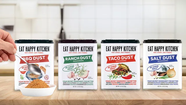 Four tins of different Eat Happy Kitchen spices.
