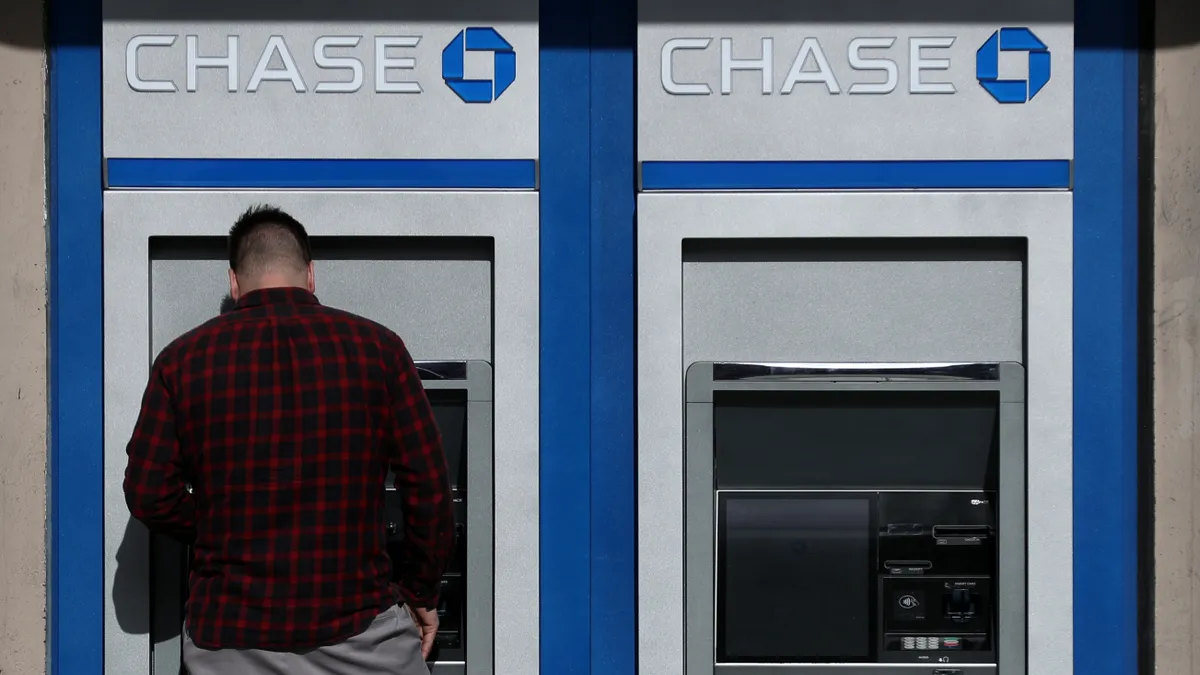 A customer uses an ATM at a Chase bank.