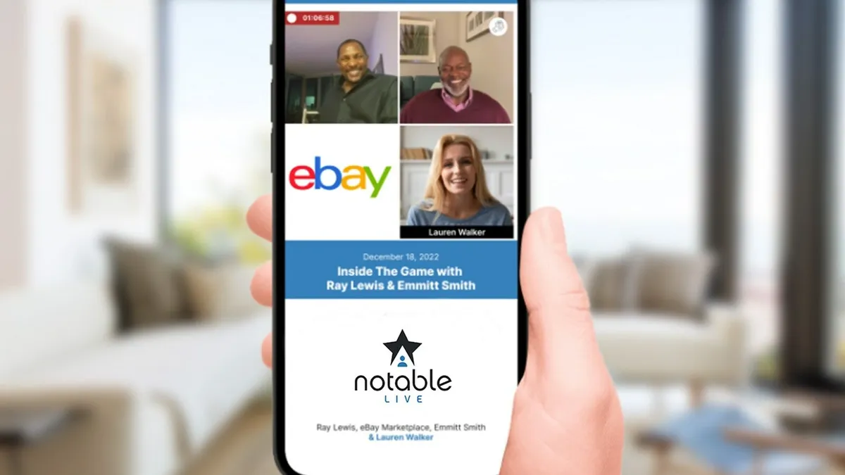 Hand holding a mobile phone with the ebay and Notable Live logos on it, as well as the faces of three different people.