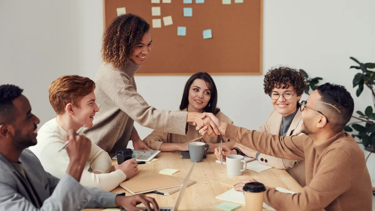 People of color work together in an office