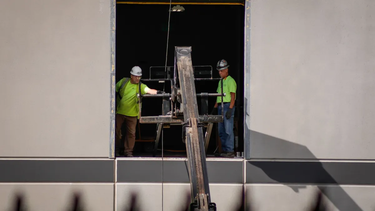 Workers seen in a unfinished building