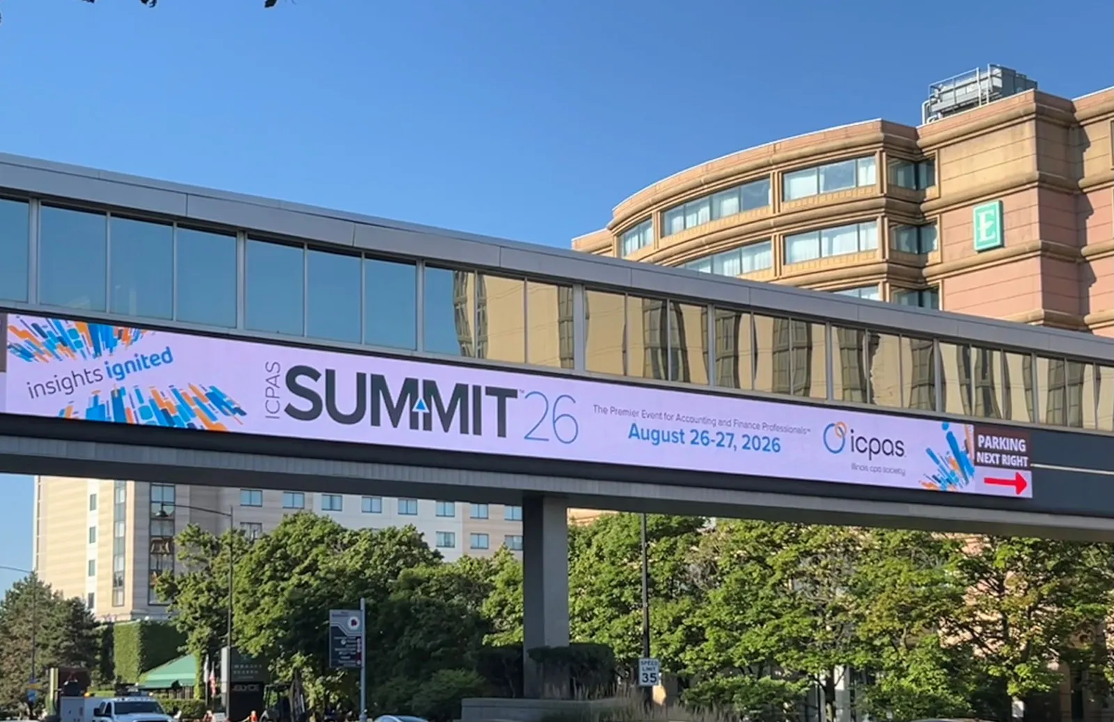 sign for a CPA conference above a road