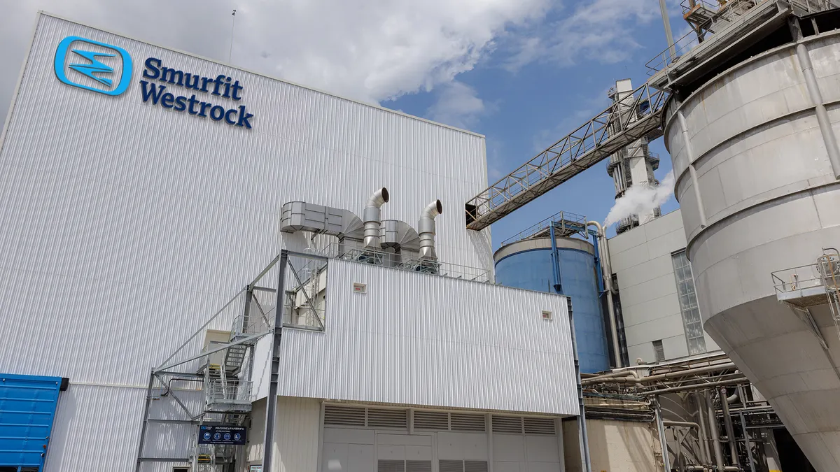 Exterior view of a manufacturing facility with the Smurfit WestRock logo