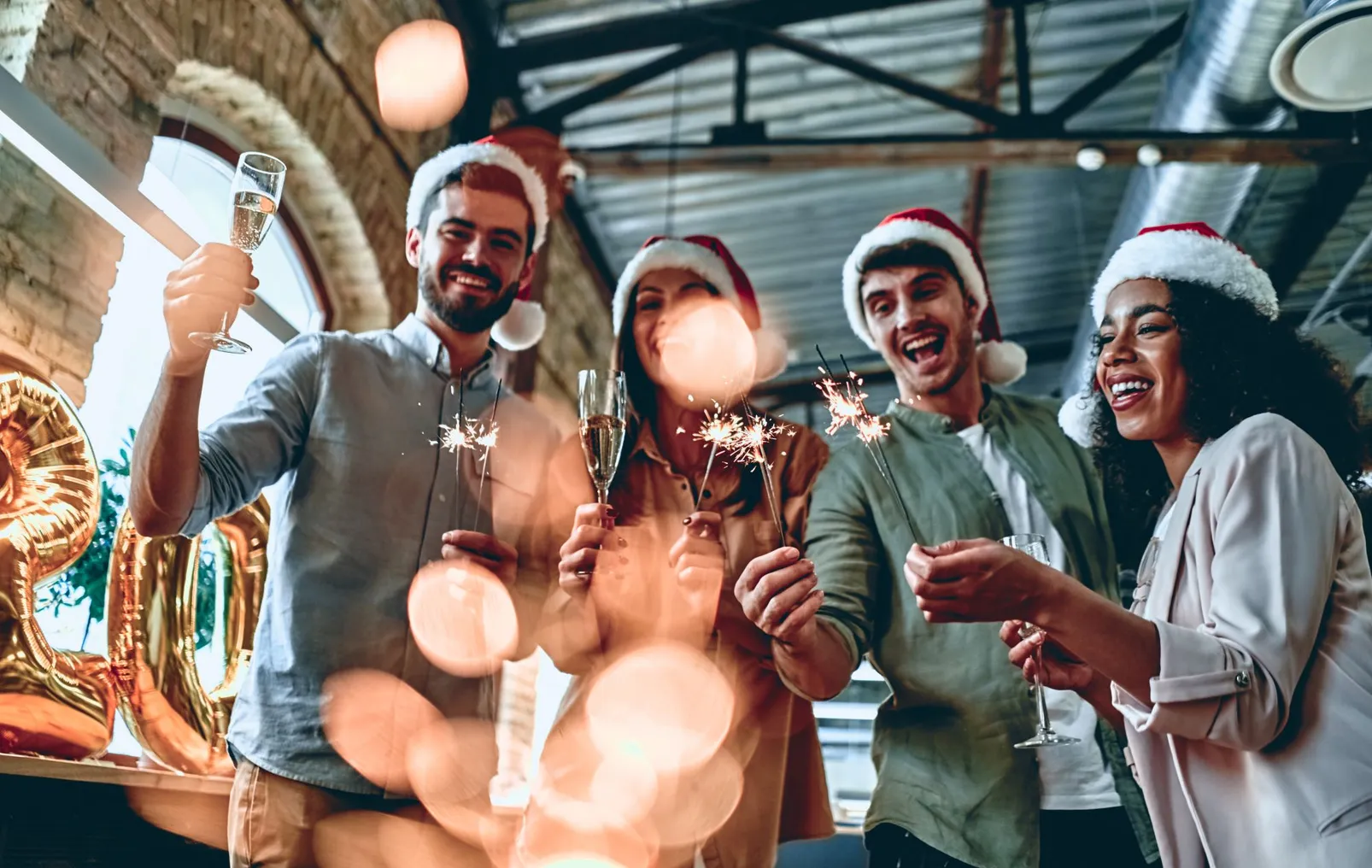 A group of young people celebrate at a Christmas party