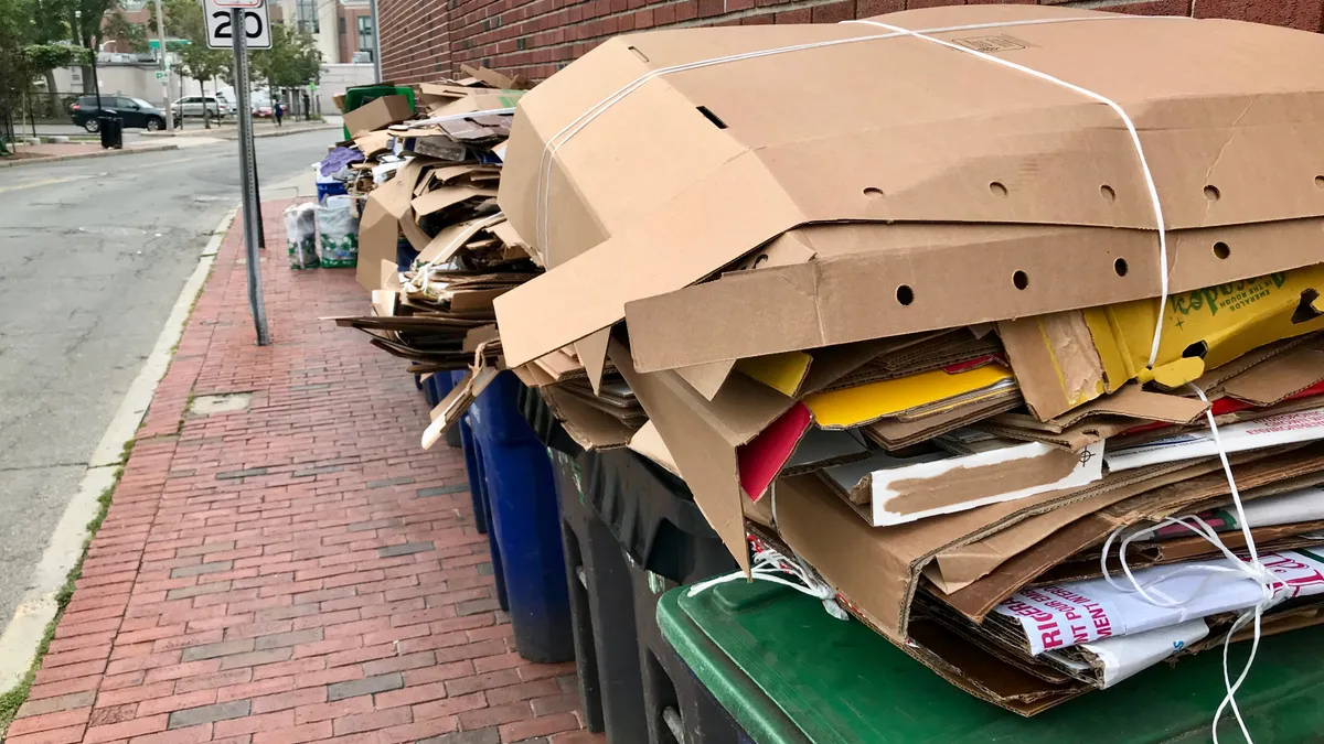 Cardboard on top of recycling carts