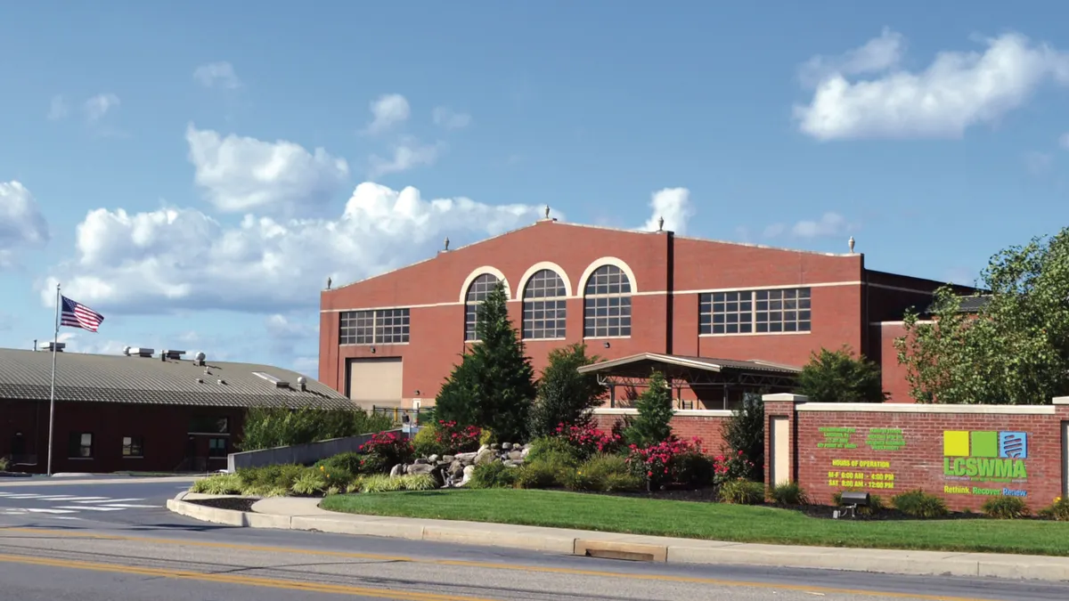 Exterior of a building with the LCSWMA logo