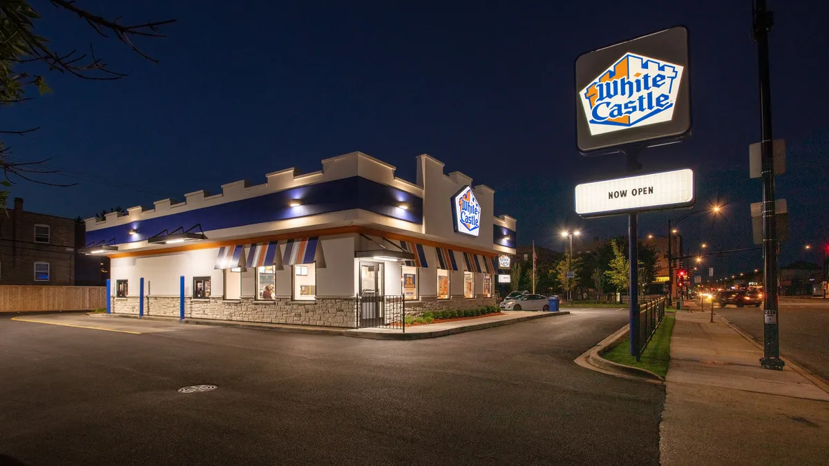 A White Castle at night. The sky is dark. The store is not.