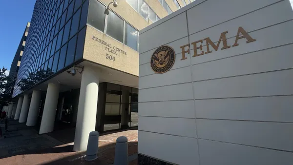 A stone building with a seal and FEMA written on it.