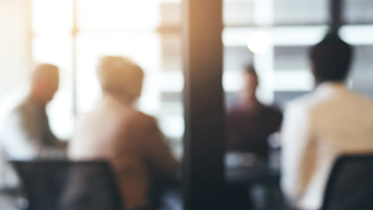 Business people, meeting and corporate discussion against a blurred background at the office. Group of employees in team planning, presentation or training staff for collaboration.