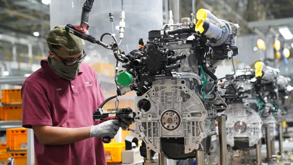 A worker assembles an engine at Hyundai Motor Manufacturing Alabama.