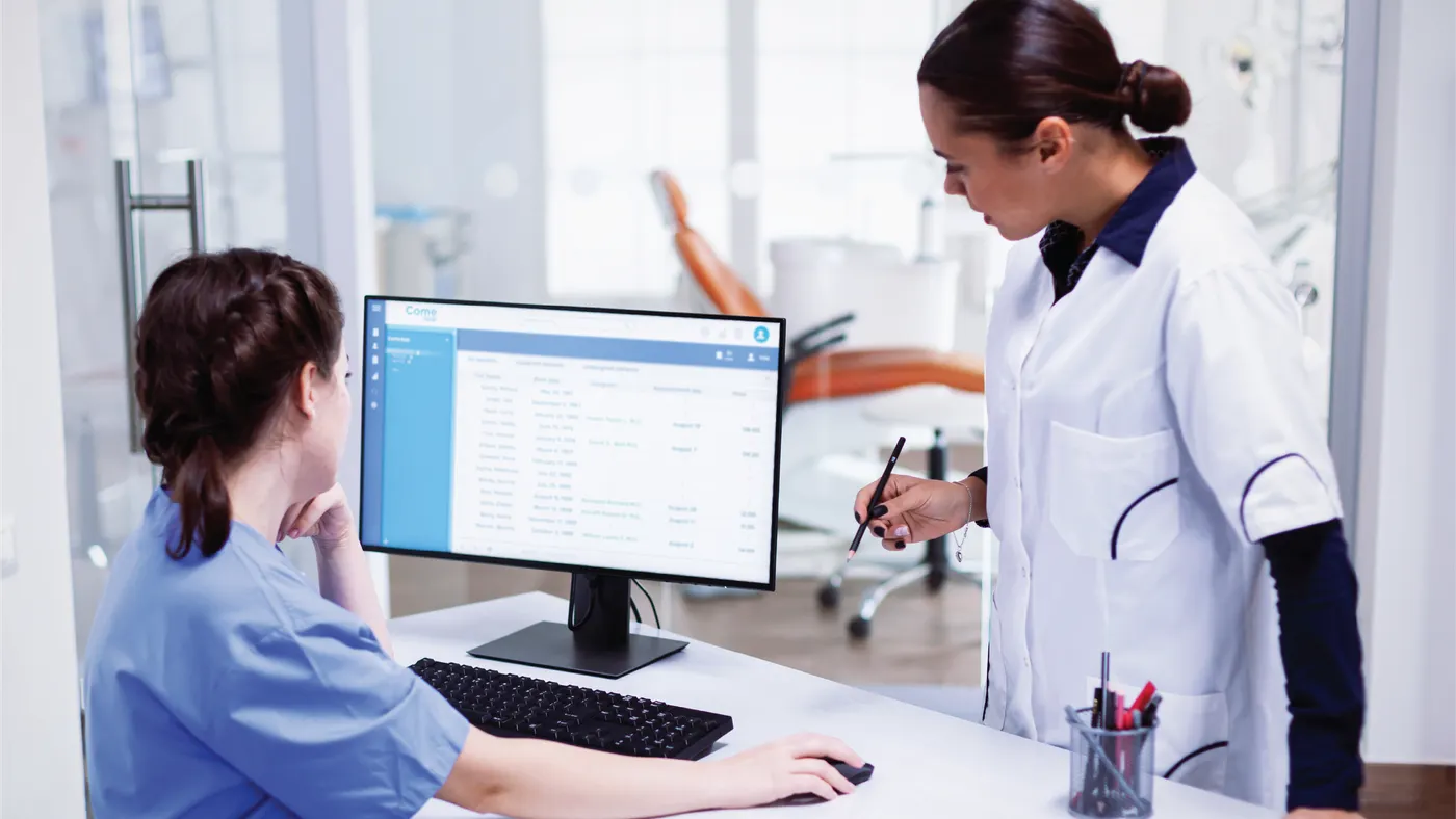 Doctor and nurse looking at a screen in a hospital