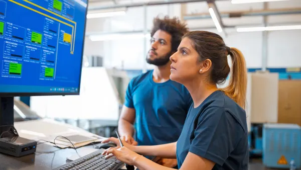 Worker looking at a desktop computer screen
