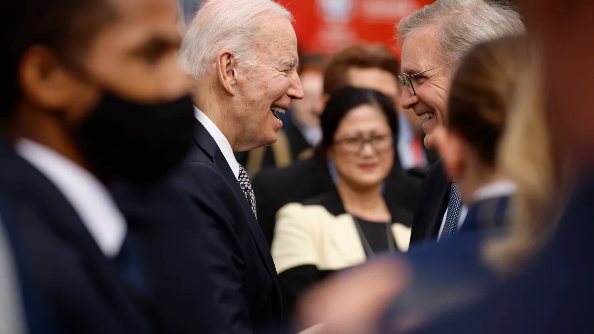 President Joe Biden greets American Trucking Associations President Chris Spear during an April 2022 Trucking Action Plan event on the South Lawn of the White House.