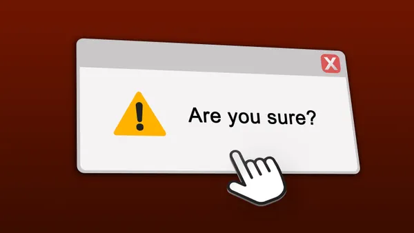 A warning message pop up on a computer screen warns of potential data loss.