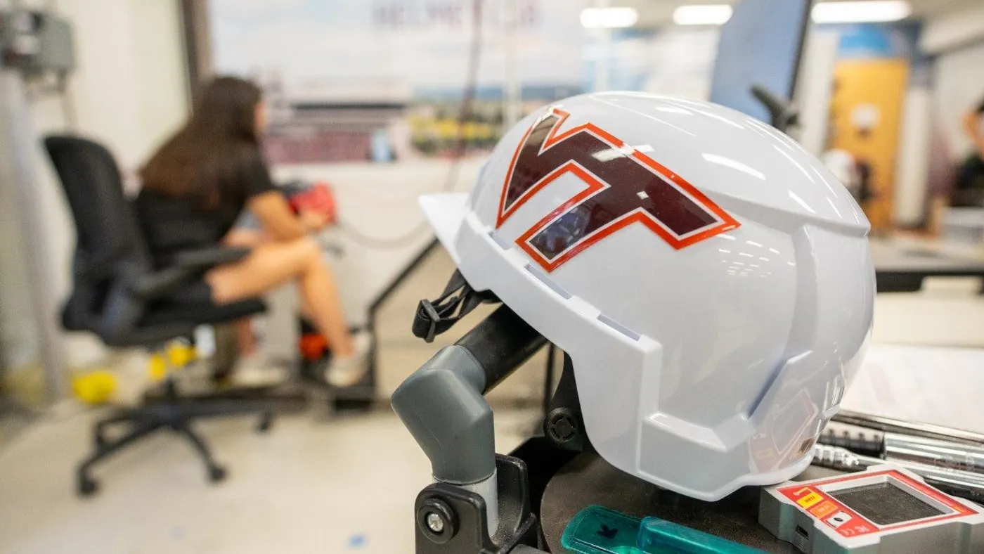 A helmet with the Virginia Tech logo in a laboratory setting.