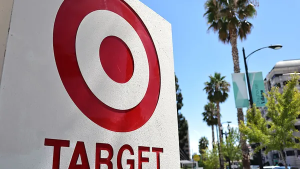 The target bulls-eye logo featured in a storefront against a sunny sky