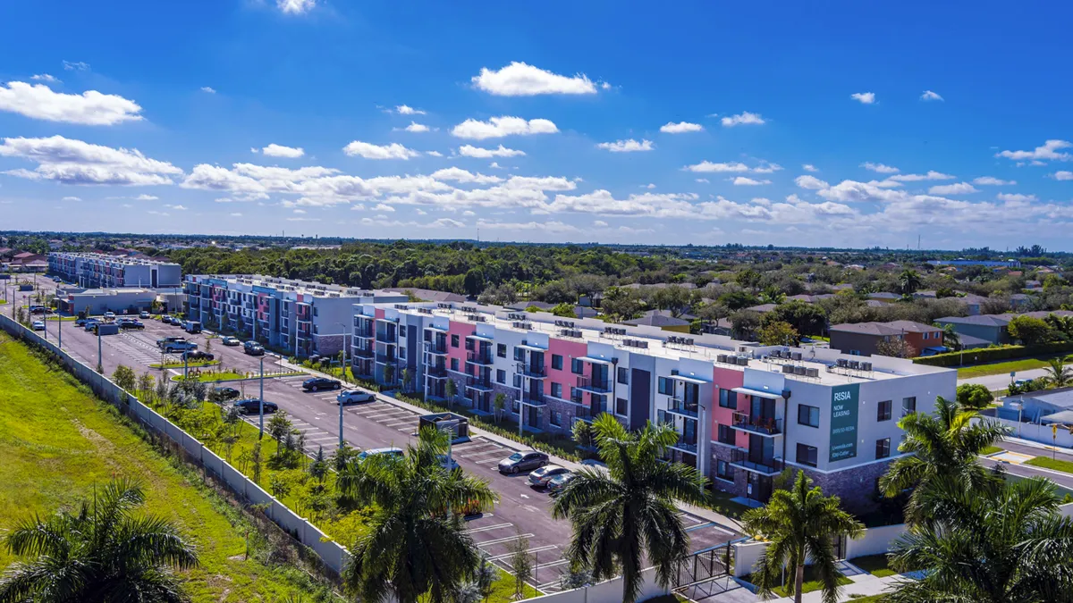 Aerial view of multi-colored apartment property