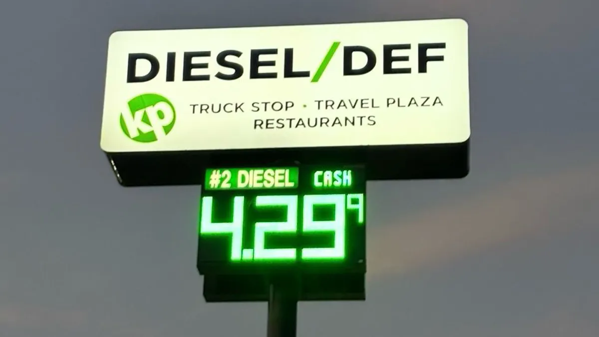 A photo of a fuel sign that says "diesel/def truck stop, travel plaza, restaurants, #2 diesel cash $4.29.9.