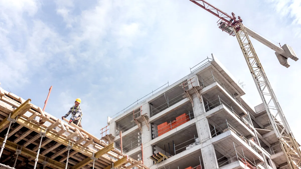 A new building is being constructed with use of tower crane