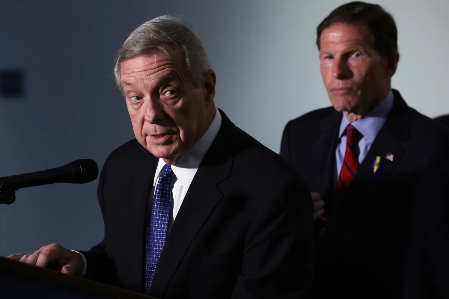 Sen. Richard Blumenthal, D-Conn., listens as Sen. Richard Durbin, D-Ill., speaks during a news conference after a hearing on gun violence on Capitol Hill on June 7, 2022.