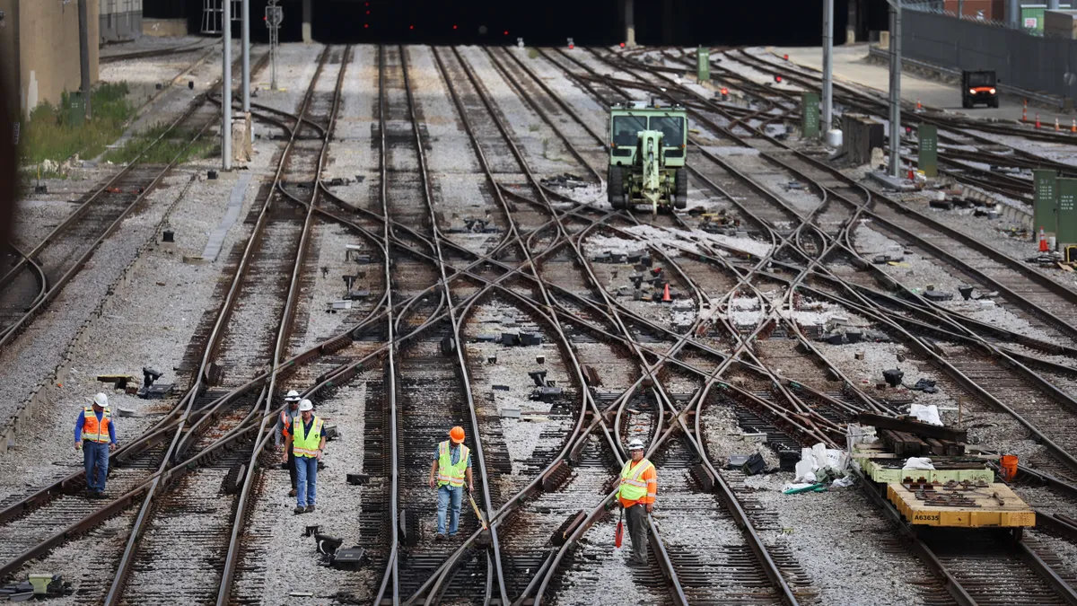 Workers service the tracks at the Metra/BNSF railroad yard outside of downtown on September 13, 2022 in Chicago, Illinois.