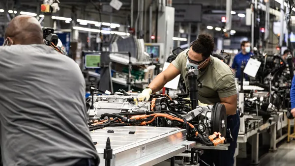 Autoworkers assemble a battery pack for an electric vehicle at the Volkswagen Group's assembly plant in Chattanooga, Tennessee.