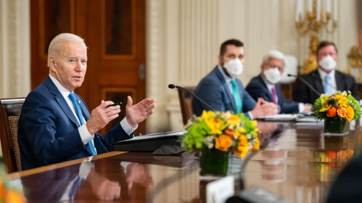 President Joe Biden speaking at a White House meeting with utility executives