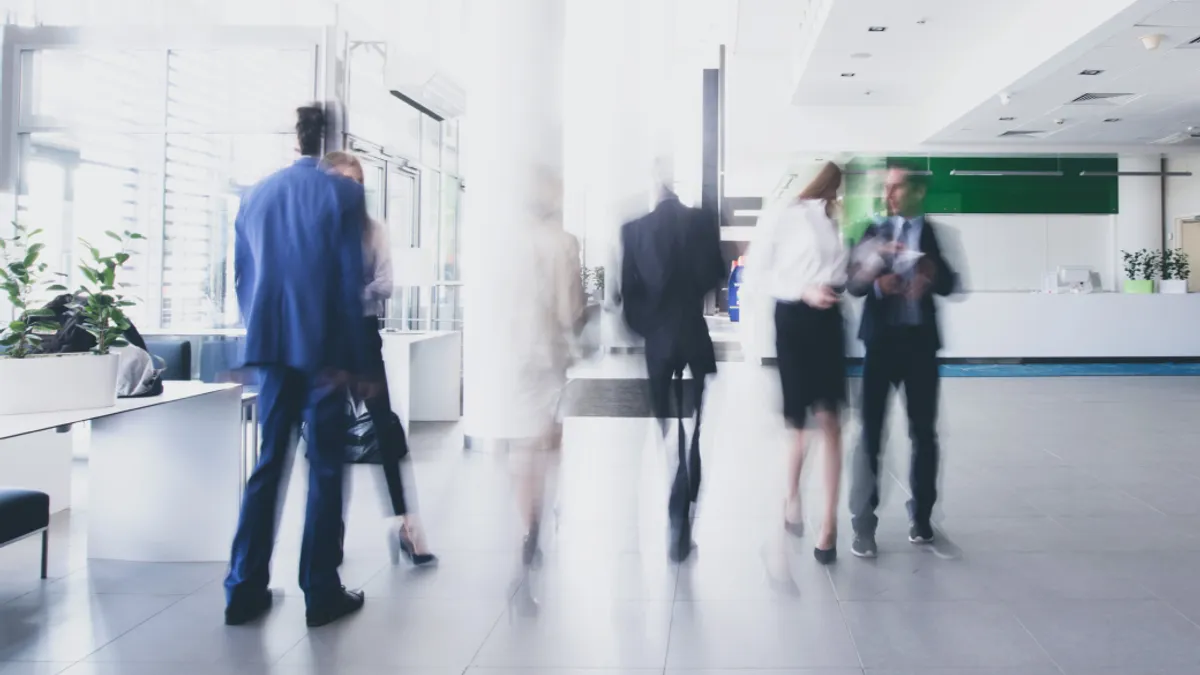 Businesspeople walking in corridor