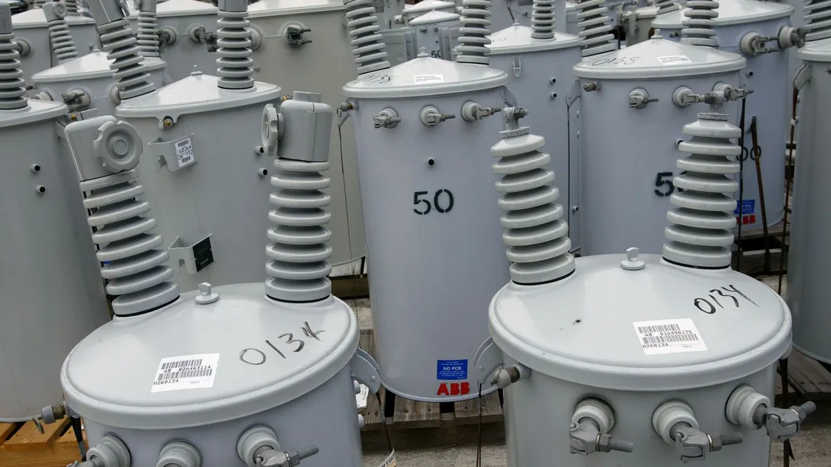 An electrical substation with breakers and transformers.