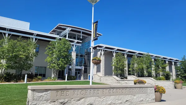 Low modern building with metal overhangs.