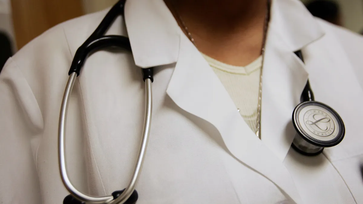 A picture of a doctor's chest with a stethoscope around the neck.