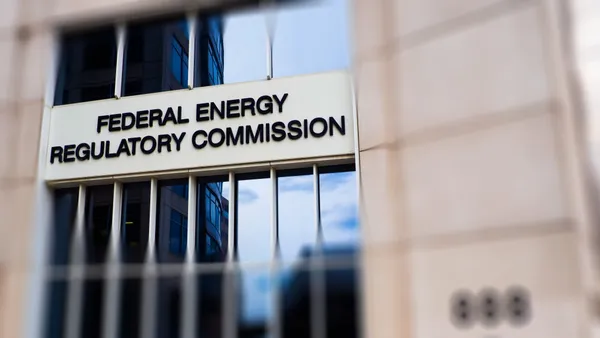 The facade of a building with large windows and a sign that says "Federal Energy Regulatory Commission."